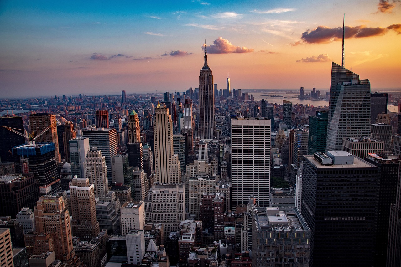 Manhattan skyline at sunset with the Empire State Building rising above Midtown New York